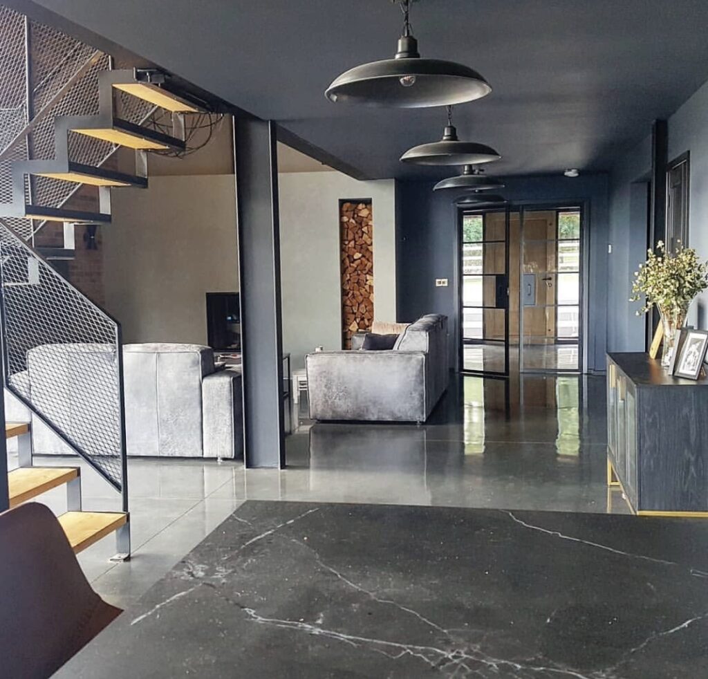 Polished concrete floor seen in a modern warehouse style conversion living room